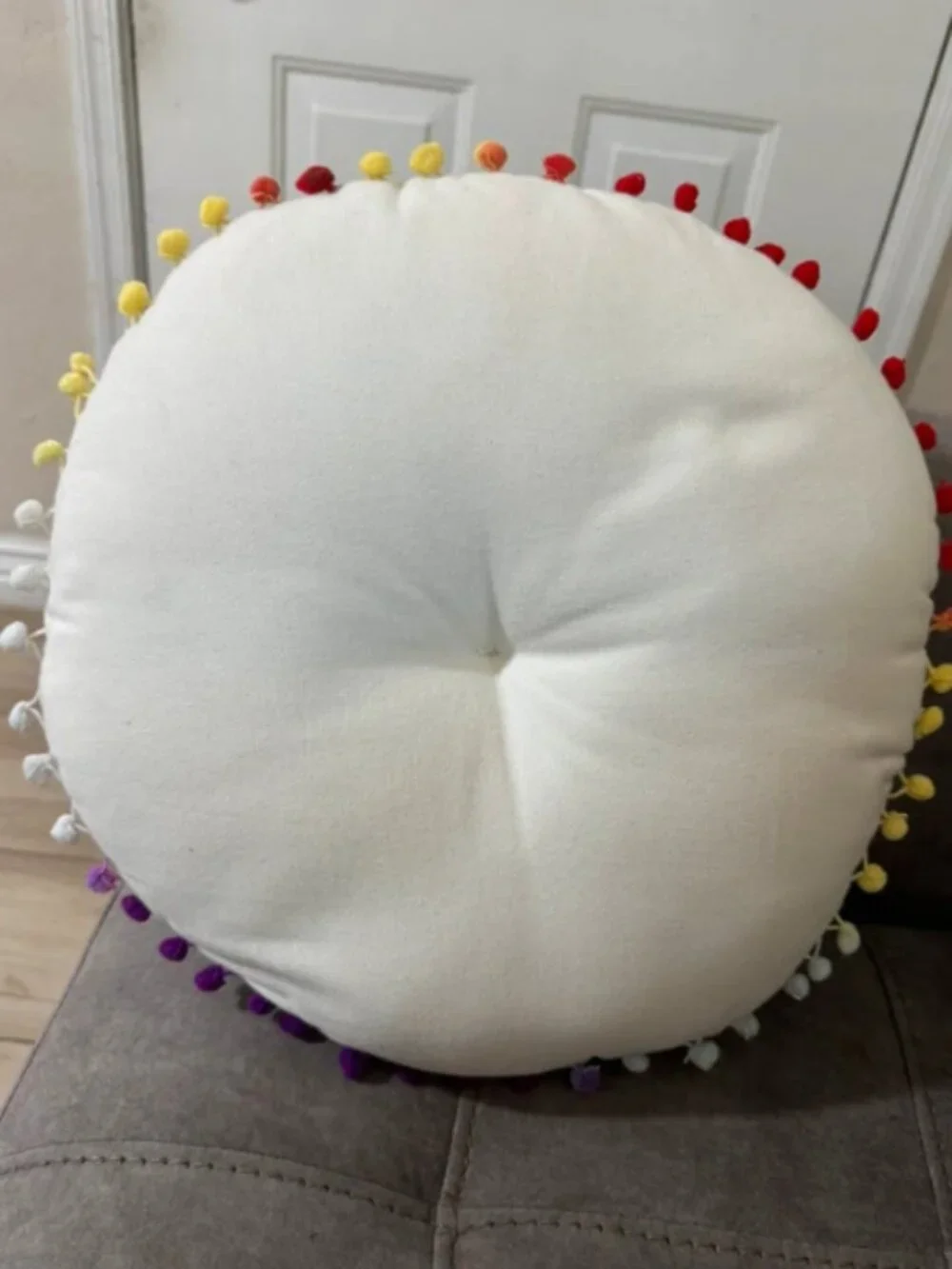 Embroidered round decorative pillow